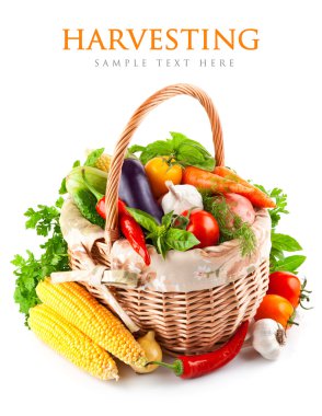 Fresh vegetables with green leaves in basket clipart