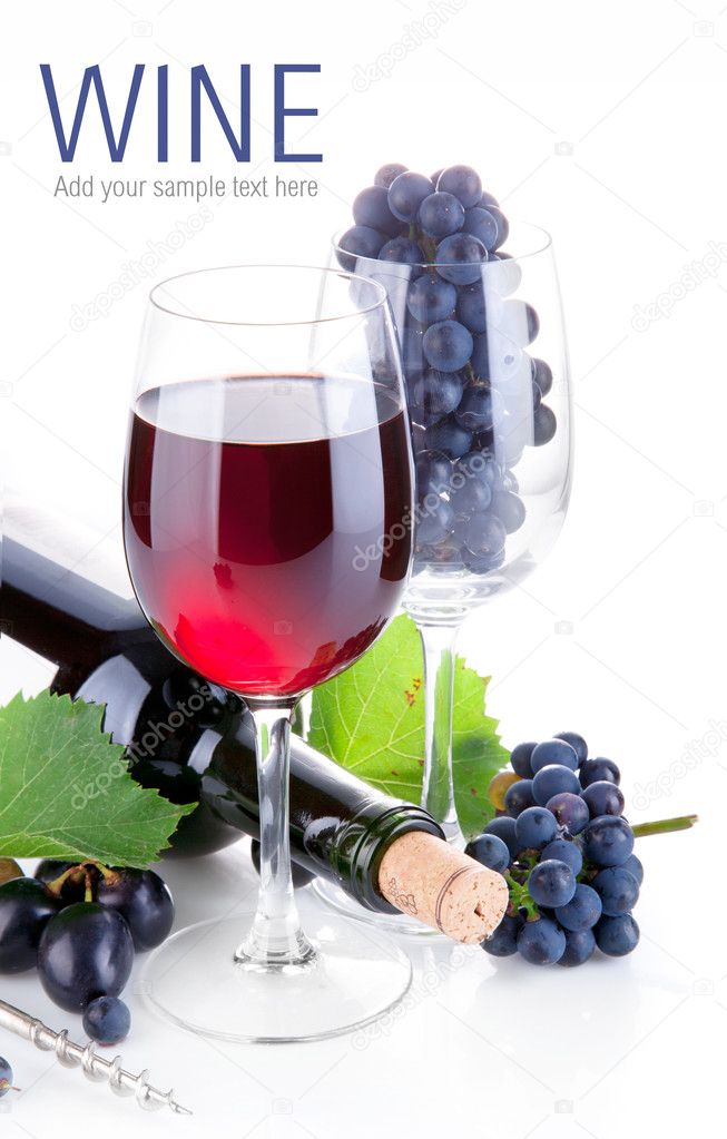 Red wine in glass with grapes