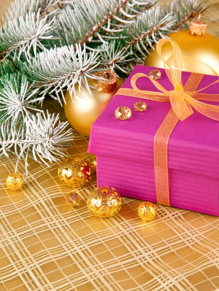 Christmas gift with branch firtree tinsel — Stock Photo, Image