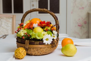 Basket with fruits and flowers clipart