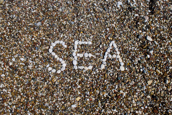 Sea inscription on a beach