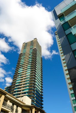 Apartment buildings in city center clipart