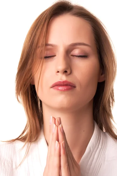 stock image Young woman sitting with pray gesture and eyes closed