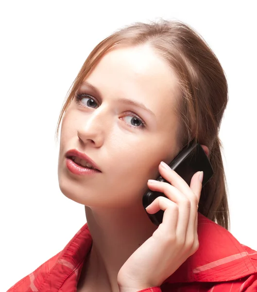 電話を持つ若い女性 ストック画像