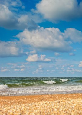 Sea beach and sky with high clouds background clipart