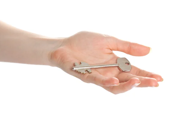 Žena ruku dává klíč — Stock fotografie