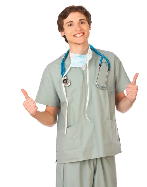 Joven médico masculino sonriendo y mostrando los pulgares hacia arriba — Foto de Stock