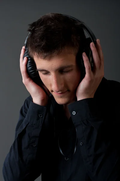 Young male person listening to music Stock Photo