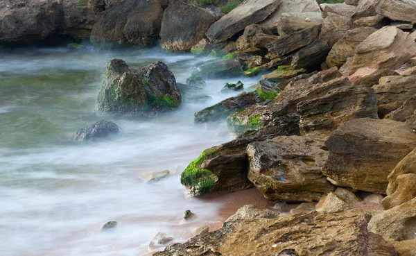 Kamenné moře pobřeží pozadí — Stock fotografie