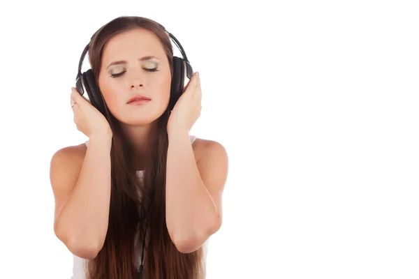 Young woman enjoyment music in headphones — Stock Photo, Image