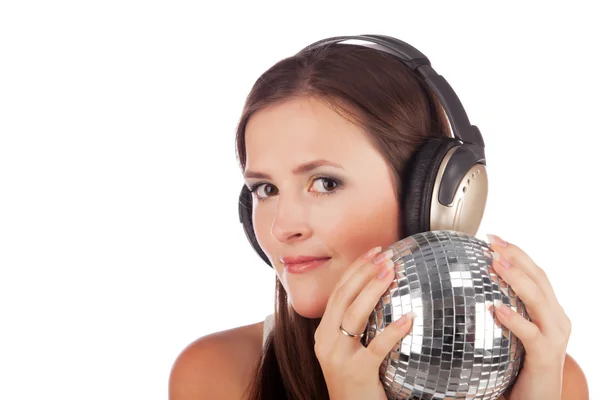 Girl in headphones and with a disco sphere in hands — Stock Photo, Image