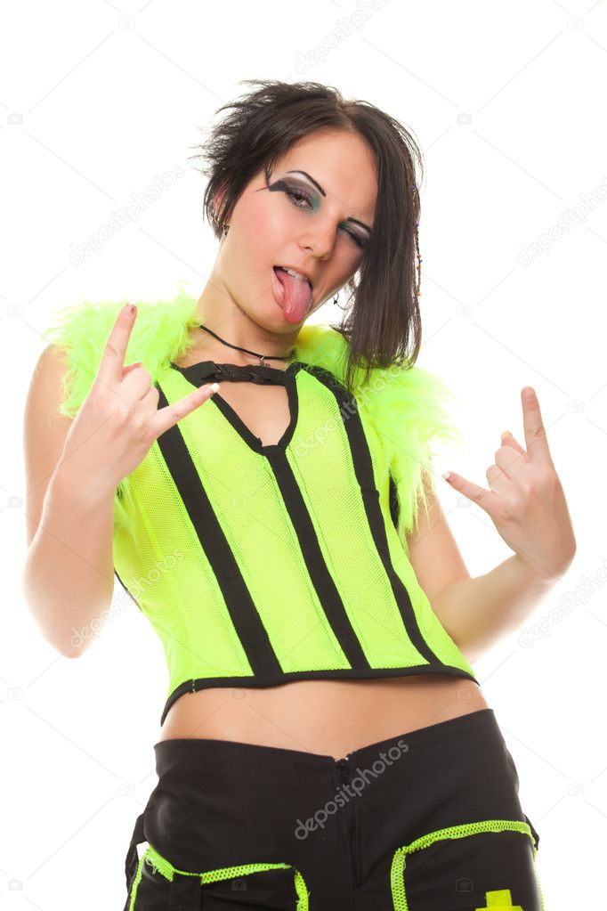 Punk girl in bright clothes shows gesture stuck her tongue