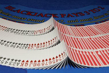 Cards on blackjack table in casino clipart