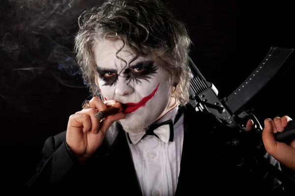 Bad joker with submachine gun and cigar — Stock Photo, Image