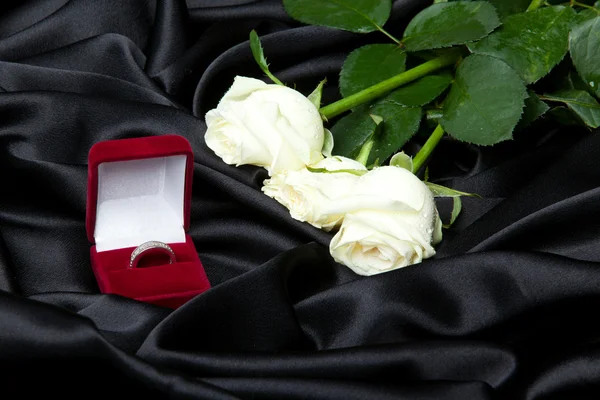 stock image Wedding concept white roses and ring in red box