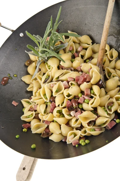 Orecchiette with bacon and peas — Stock Photo, Image