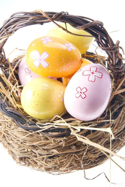 Easter Eggs in bast basket — Stock Photo, Image