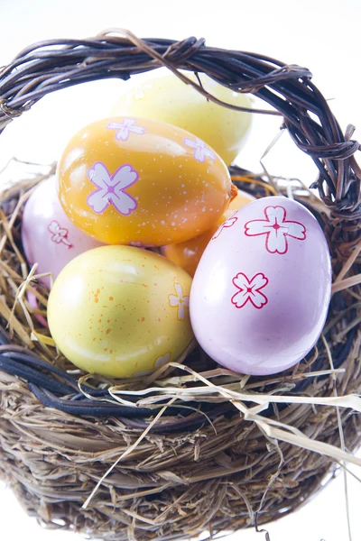 Easter Eggs in bast basket — Stock Photo, Image
