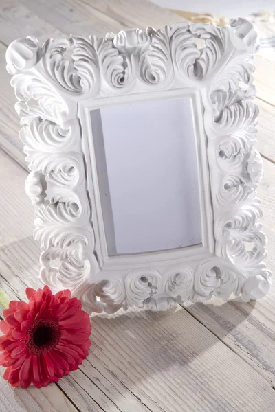 Blank photo frame and flower — Stock Photo, Image