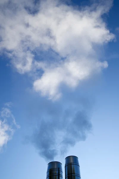 Industrial smoke from chimney on blue sky — Stock Photo, Image