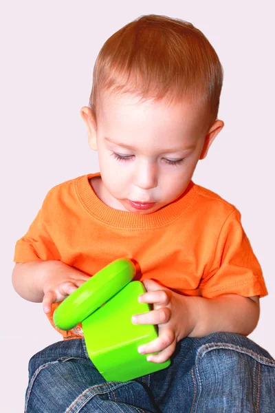 stock image Baby plays with toys