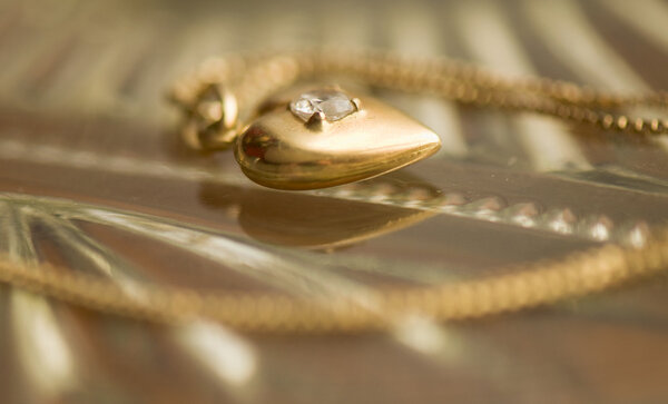 Gold chain and pendant the heart