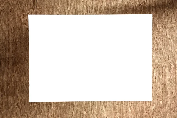 White paper on wood floor — Stock Photo, Image