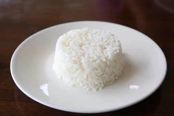 Ryż w tle z drewna — Zdjęcie stockowe