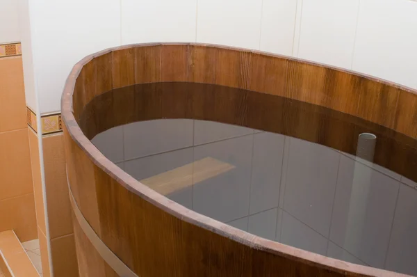 Bathtub in sauna full of water — Stock Photo, Image