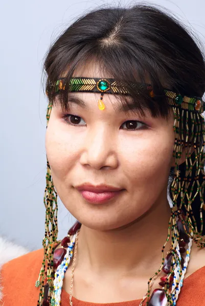 Portrait of young beautiful chukchi woman in folk dress — Stock Photo, Image