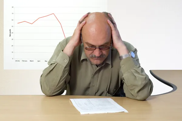 Project manager looks at the financial account — Stock Photo, Image