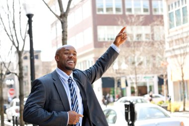 Business Man Hails a Taxi clipart