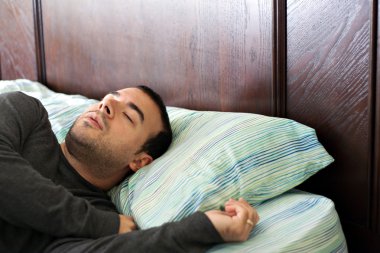 Man Sleeping In Bed