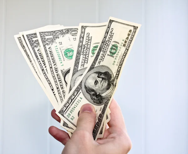 Dollar banknotes in hand — Stock Photo, Image