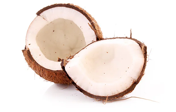 Två halvor kokos på vit bakgrund — Stockfoto