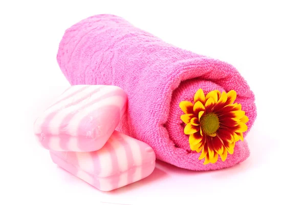 Soap, flower and towel on white — Stock Photo, Image