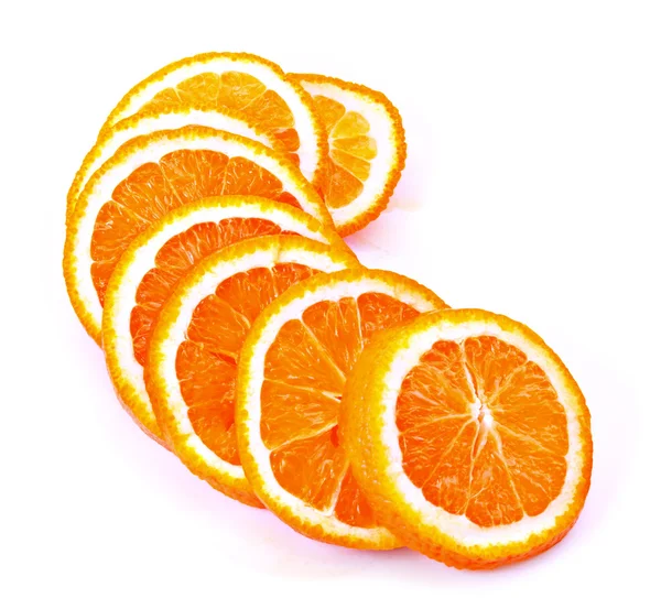 Viele geschnittene Orangen — Stockfoto