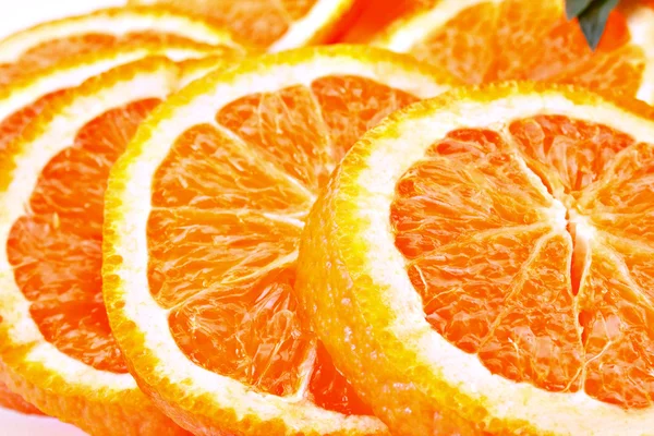 Много нарезанных апельсинов — стоковое фото
