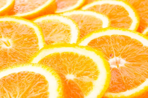 Många skivade apelsiner — Stockfoto