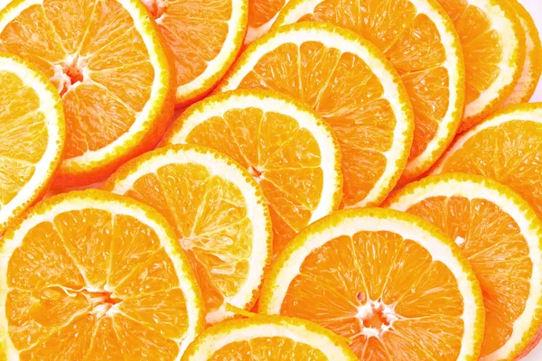 Muitas laranjas fatiadas — Fotografia de Stock