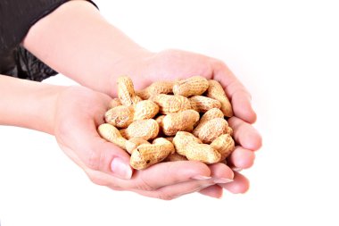 Peanuts in hand isolated on white