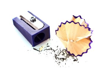 Pencil sharpener and shavings on a white background clipart