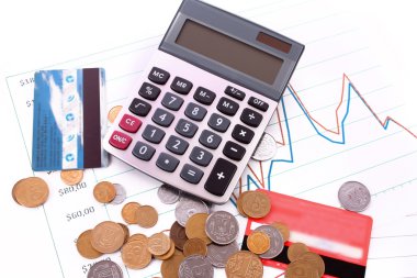 Calculator , credit card and coins on chart background (Ukrainin clipart