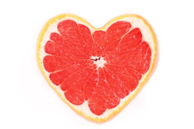 Close up of sliced pink grapefruit in the form of heart isolated clipart