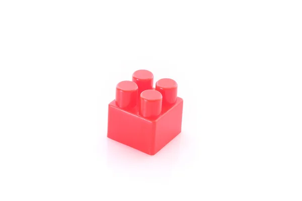 Roter Spielzeugbaustein isoliert auf weißem Grund — Stockfoto