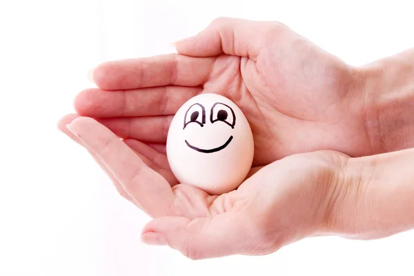 A kezében elszigetelt, a fehér tojás — Stock Fotó