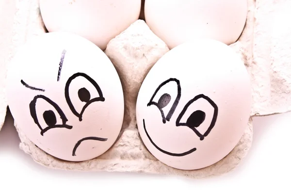 Différents œufs - avec sourire et colère — Photo