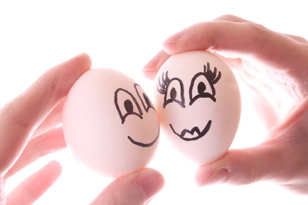 To egg i hender isolert på hvitt – stockfoto