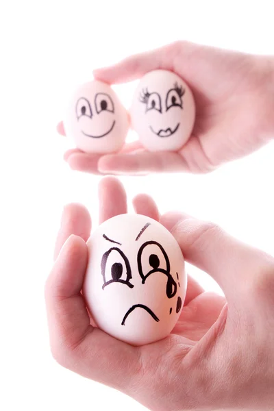 Drie eieren in handen geïsoleerd op wit — Stockfoto