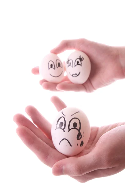 Tre uova in mani isolate su bianco — Foto Stock